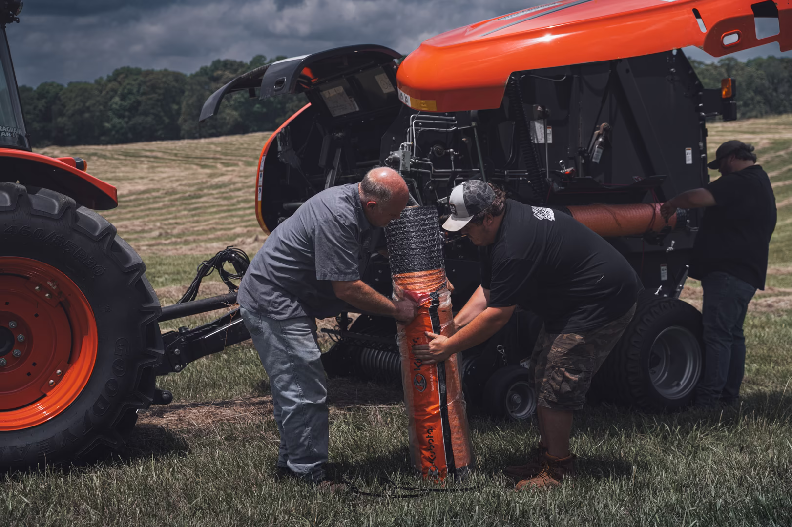 New Holland Tractor with Baler in Field