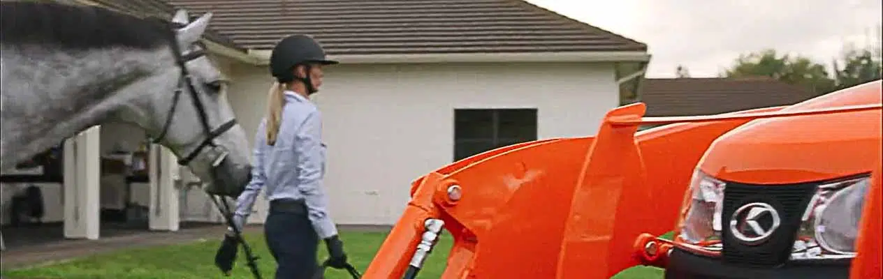 Kubota Tractor and Woman Horseback Rider