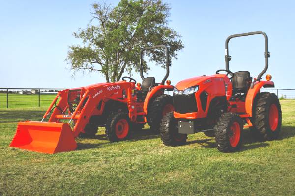 A Kubota tractor and construction vehicle.
