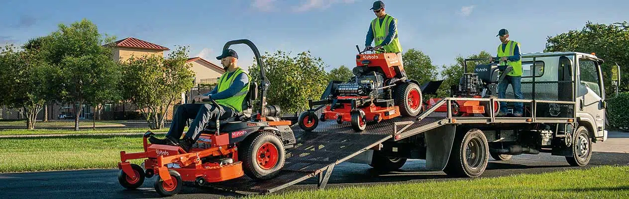 Landscaping equipment being offloaded from a truck