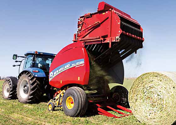 New Holland Tractor with Baler in Field