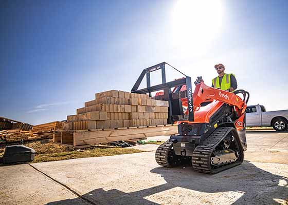 Track loader driver doing light construction